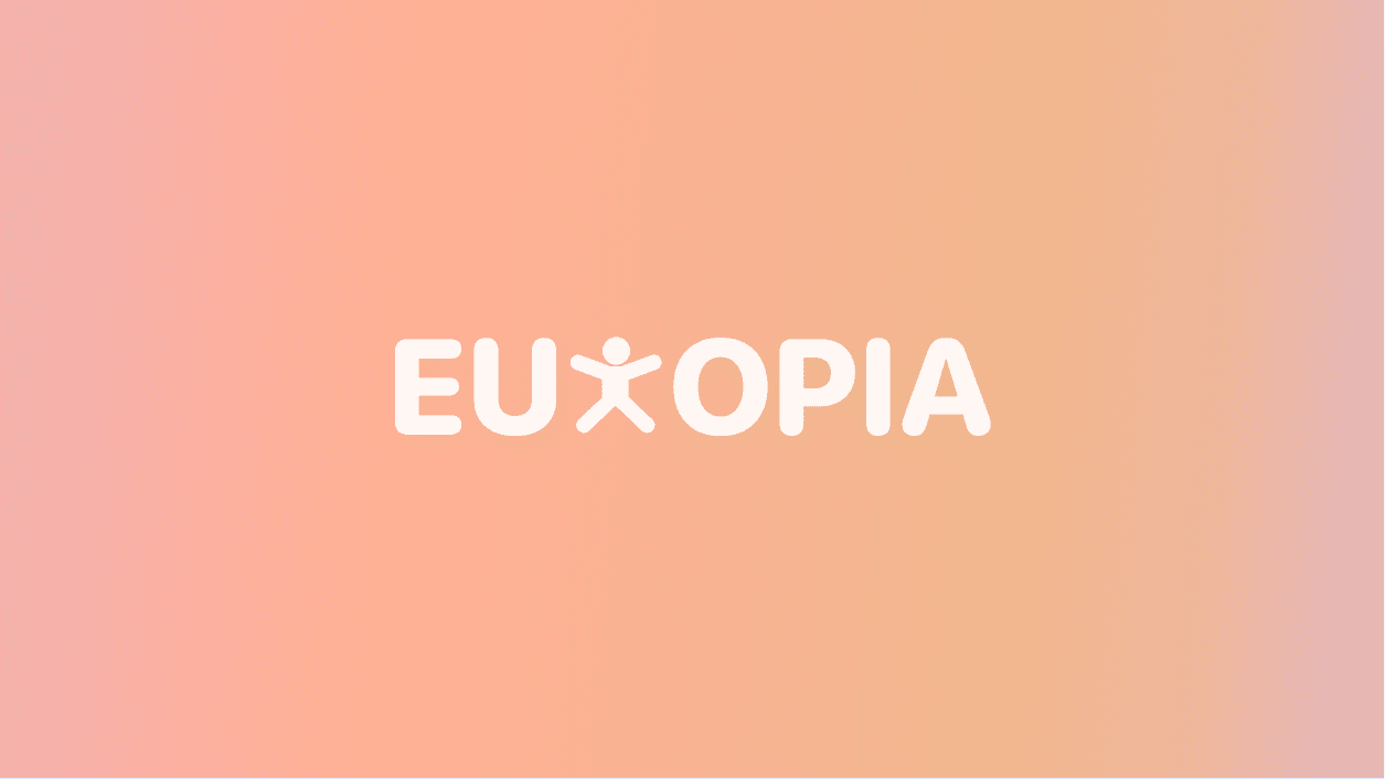 a cellphone leaning against a wall