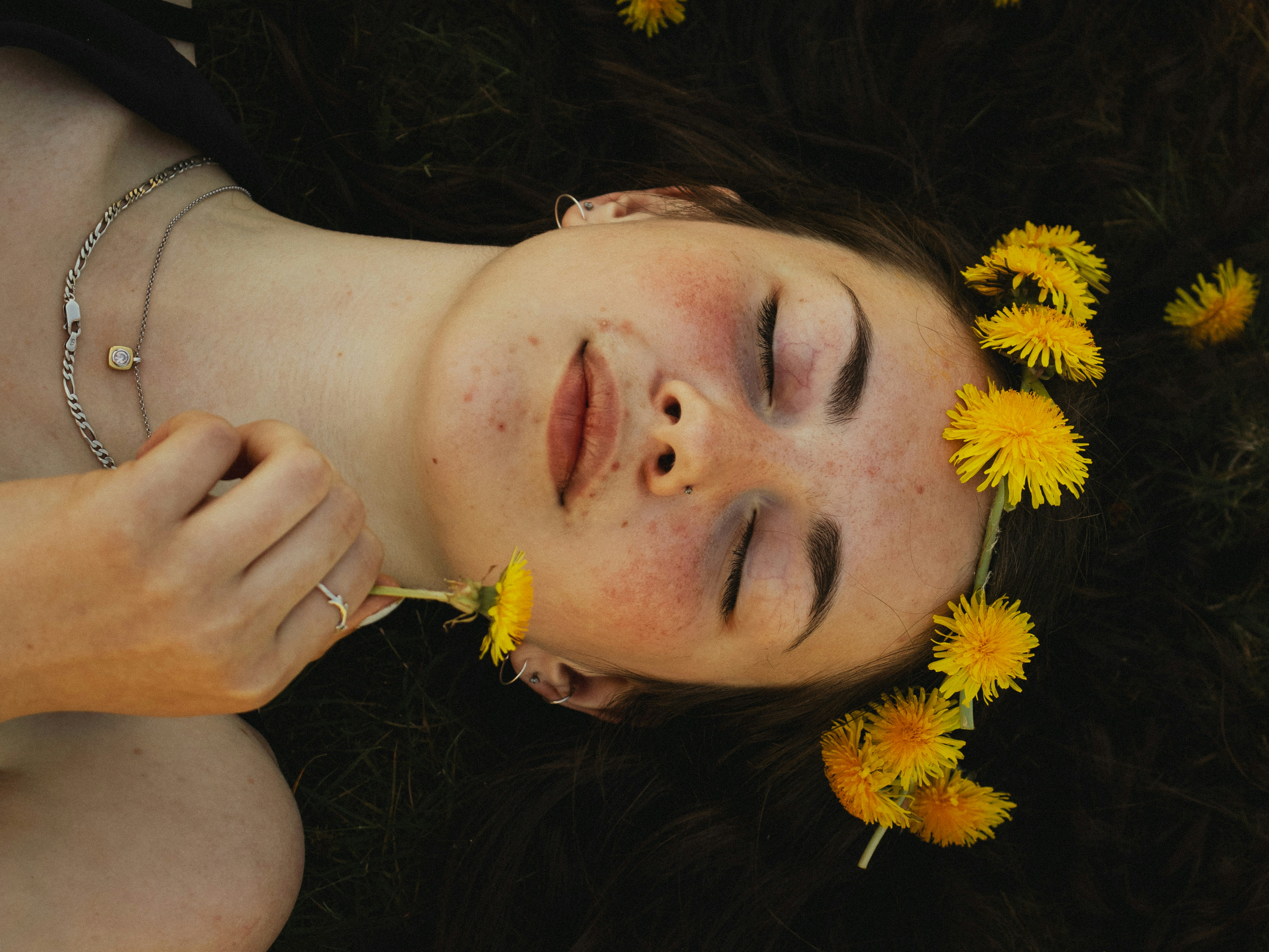 woman with sunflowers laying down - Glow Up Ideas