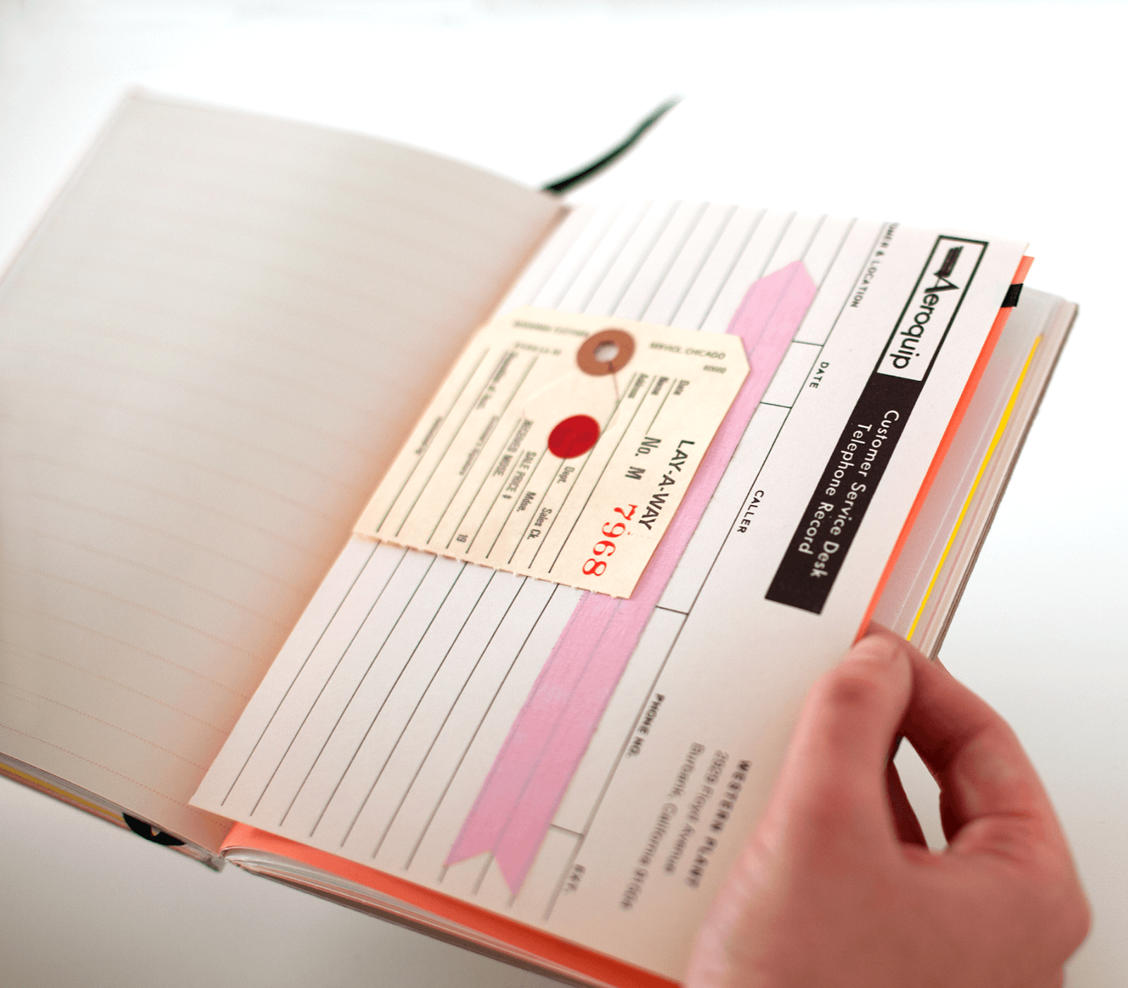 Open spread with collage mailing forms and manila sales ticket. Includes pink arrow.