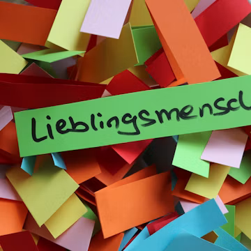 a pile of colorful pieces of paper with the word libings mescu