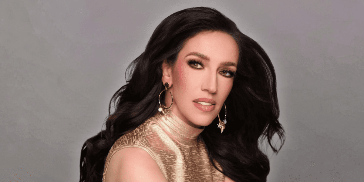 Mikell Reed Carroll, a pageant coach and former lawyer, wearing a gold dress with hoop earrings, exuding confidence.