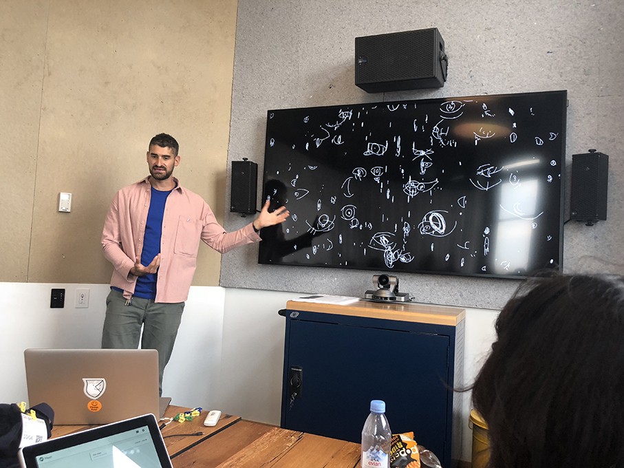 a course class with students and the teacher presenting the design lesson