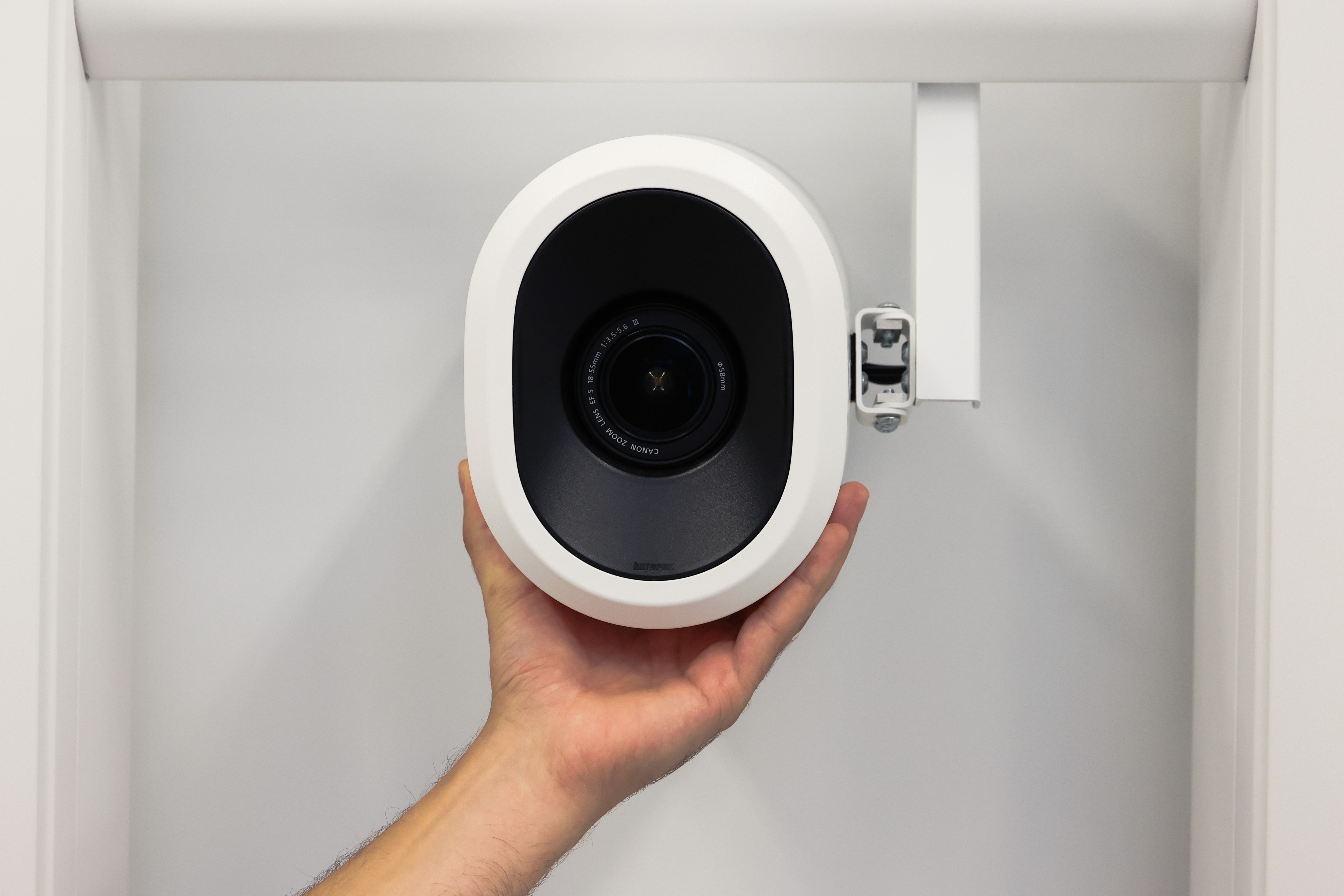 Inside of botspot's showroom, with a NEO full-body scanner with its doors open, and scan computers in the background.