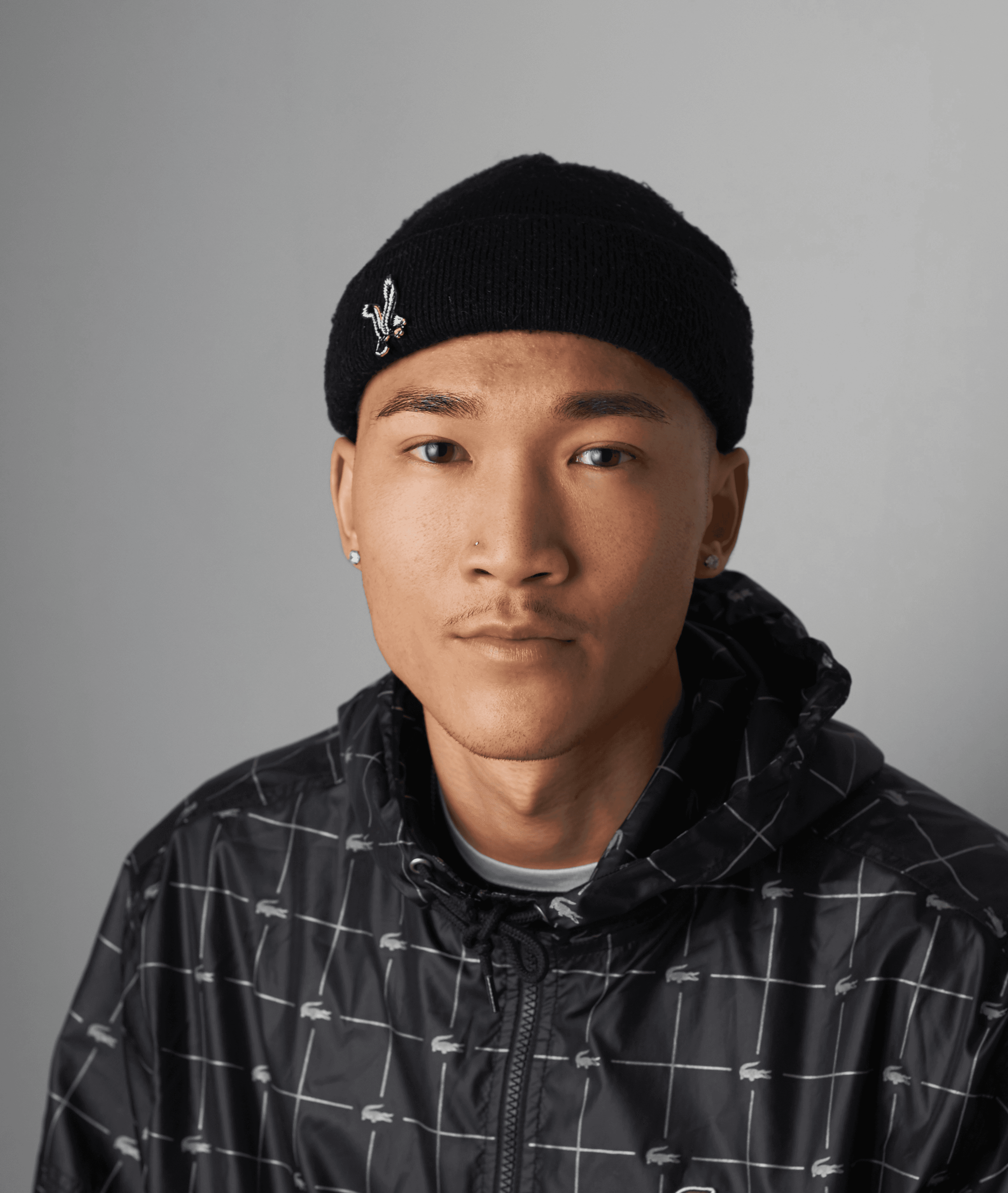 man wearing Lacoste zip-up hooded top