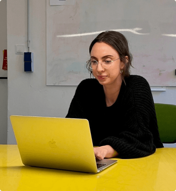 Penny working on a Macbook Laptop