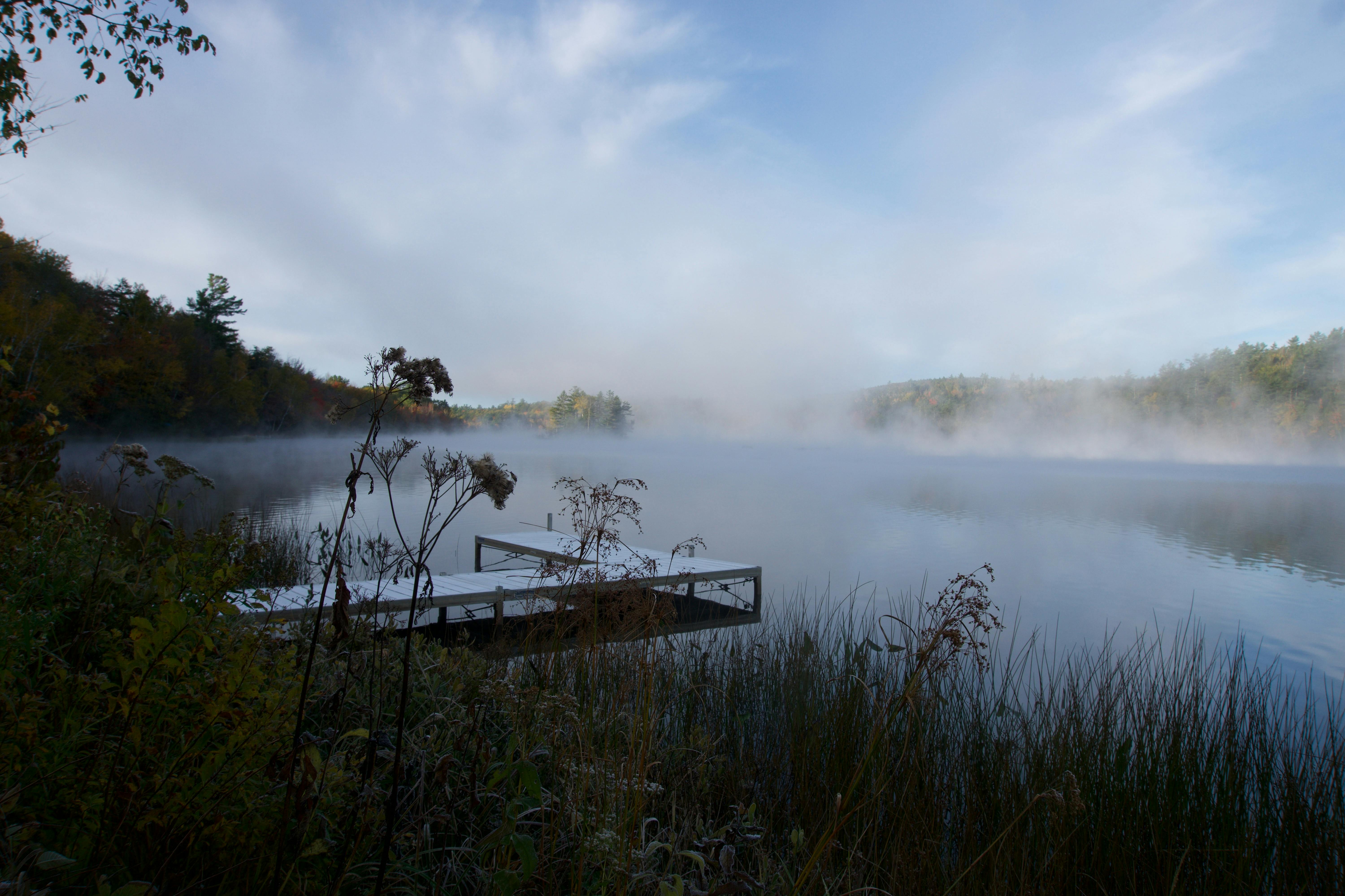 sunrise on a foggy lake