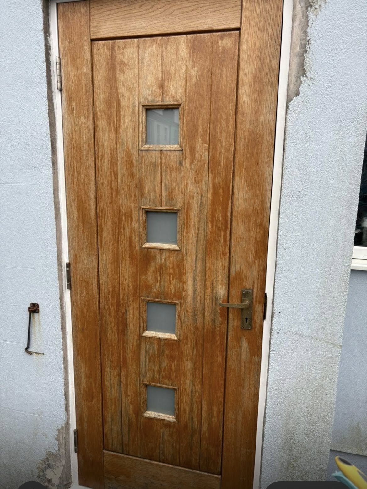 a person holding a small orange button in their left hand