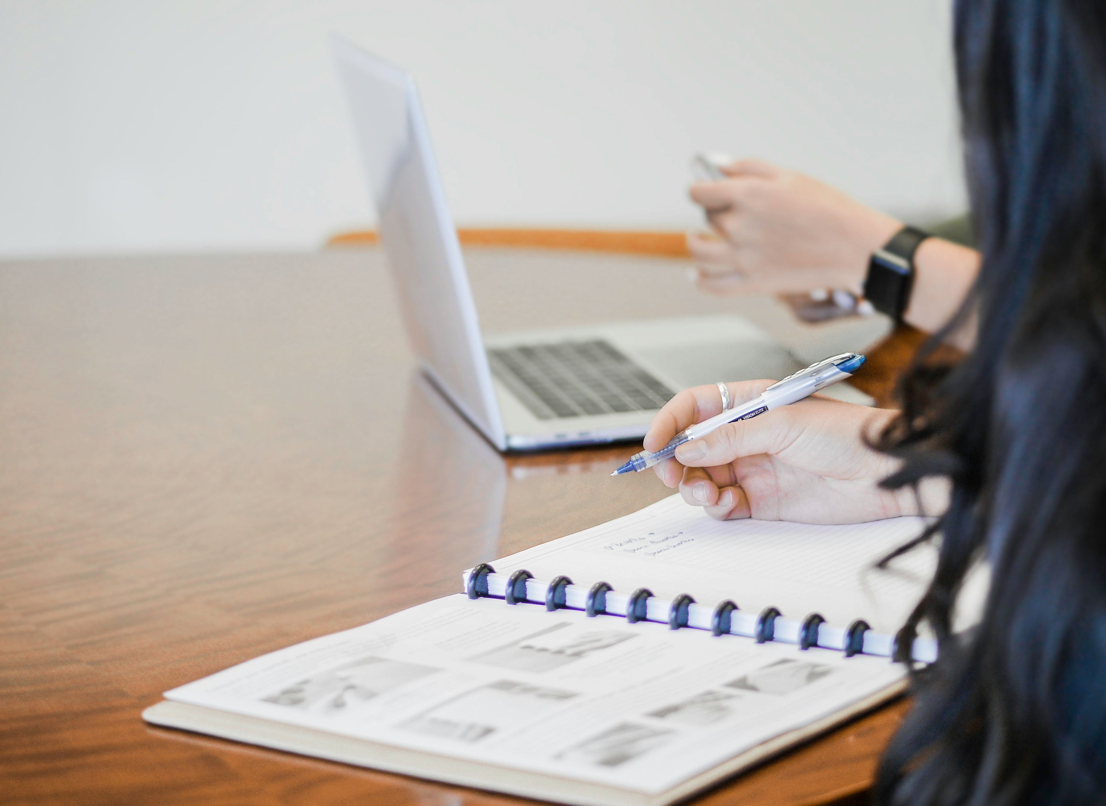 woman making notes - How Many Sources Should A Research Paper Have