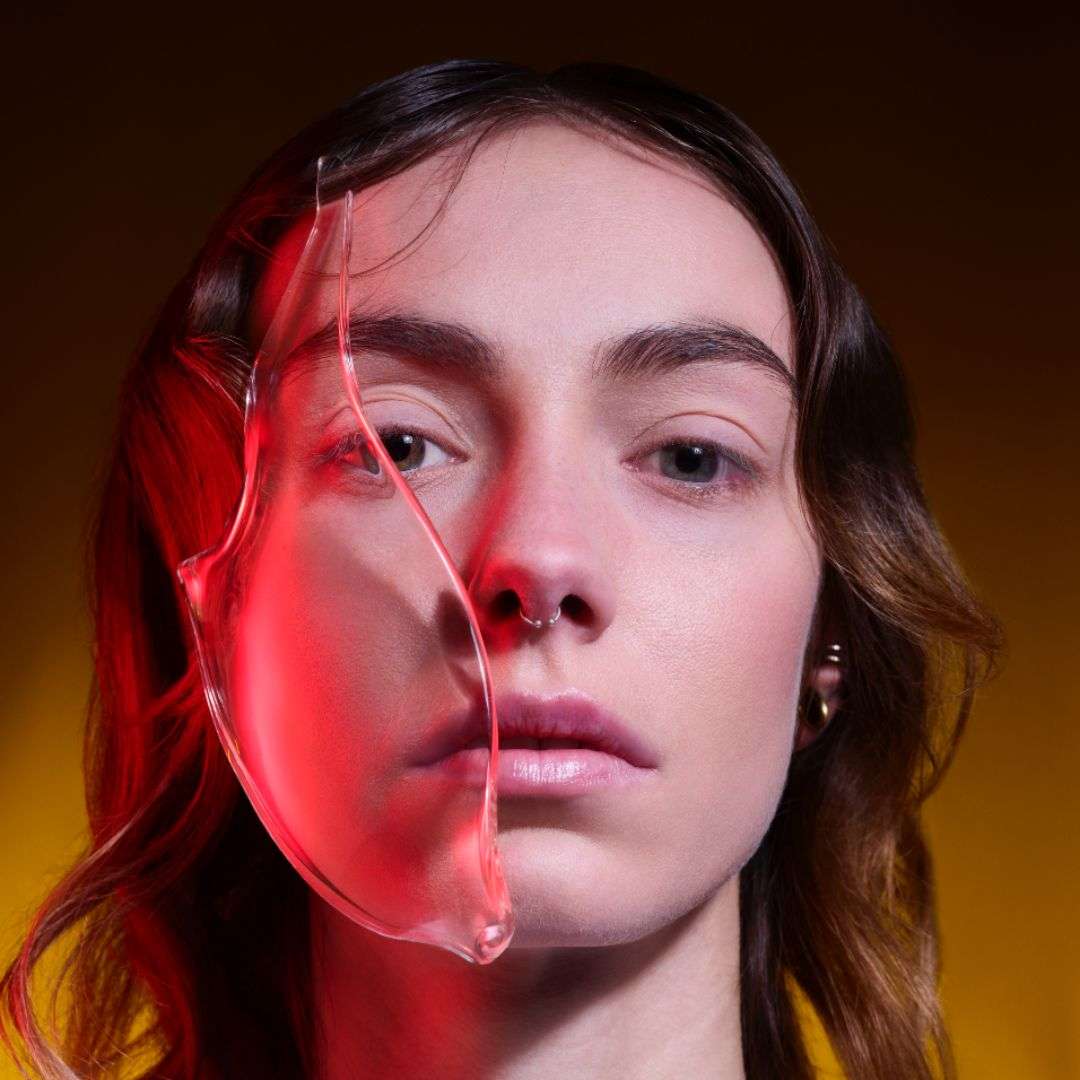 Artistic beauty portrait with liquid texture overlay highlighting skincare formulation and I.D. Swiss Botanicals campaign identity