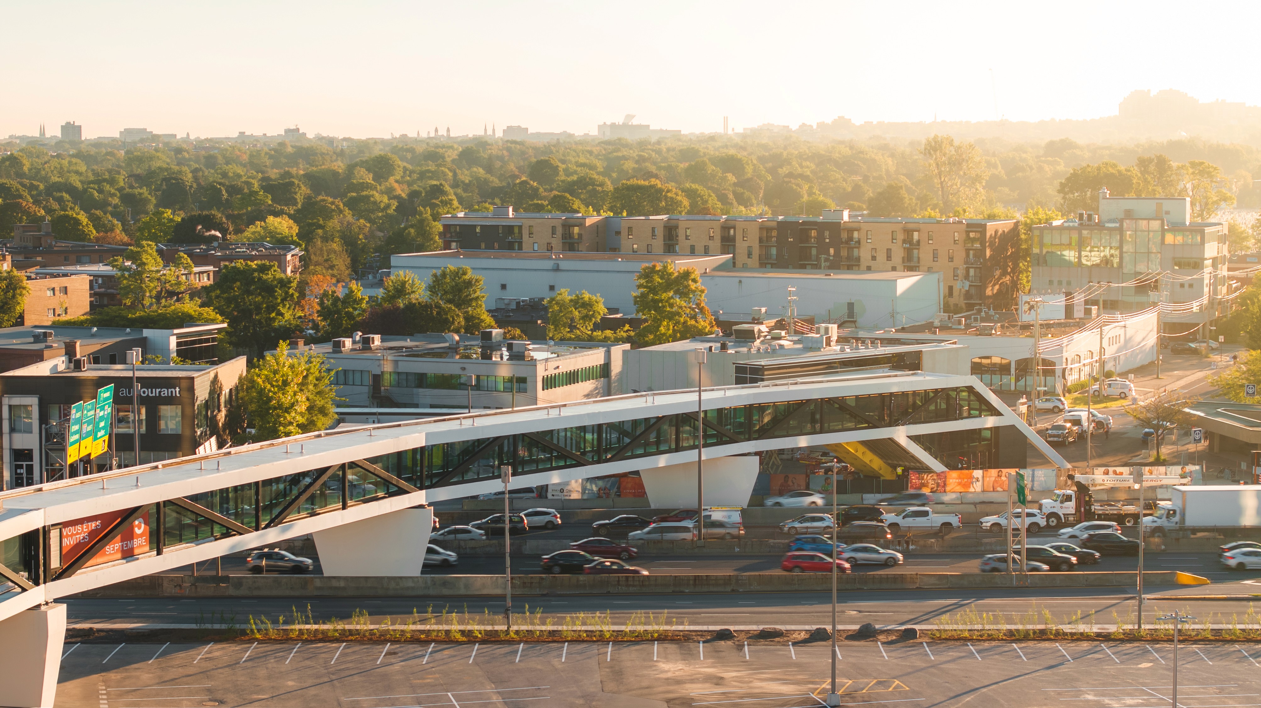 aerial view of a pedestrian tunnel in a shopping center above a highway