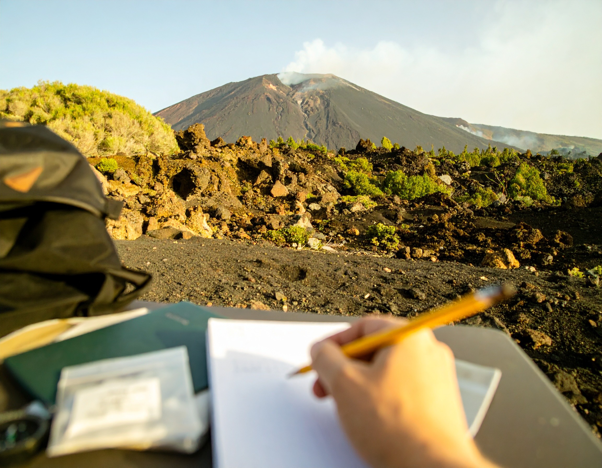 field desk with volcano in background