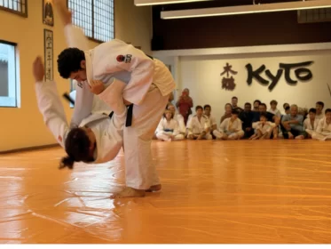 Two students practicing striking drills during a kickboxing class.