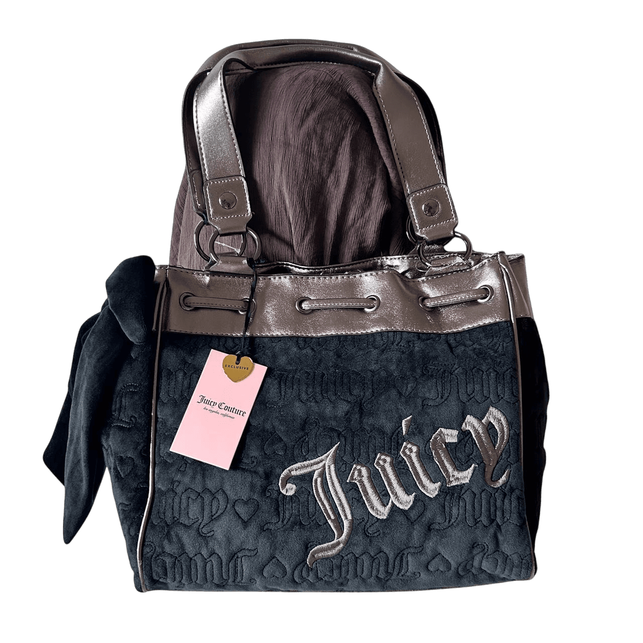 A dark glass bottle with a pump sits on a stone, surrounded by green leaves and textured background.