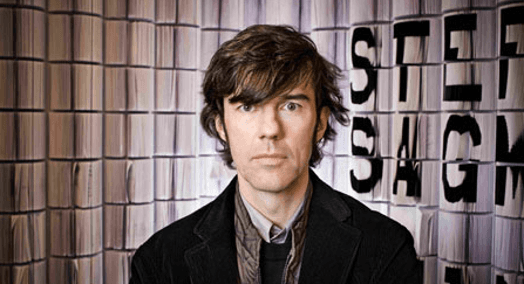 A photo of a man dressed in a suit.