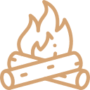 Icône d’un feu de camp, illustrant l’accès à des espaces extérieurs partagés comme le rond de feu.