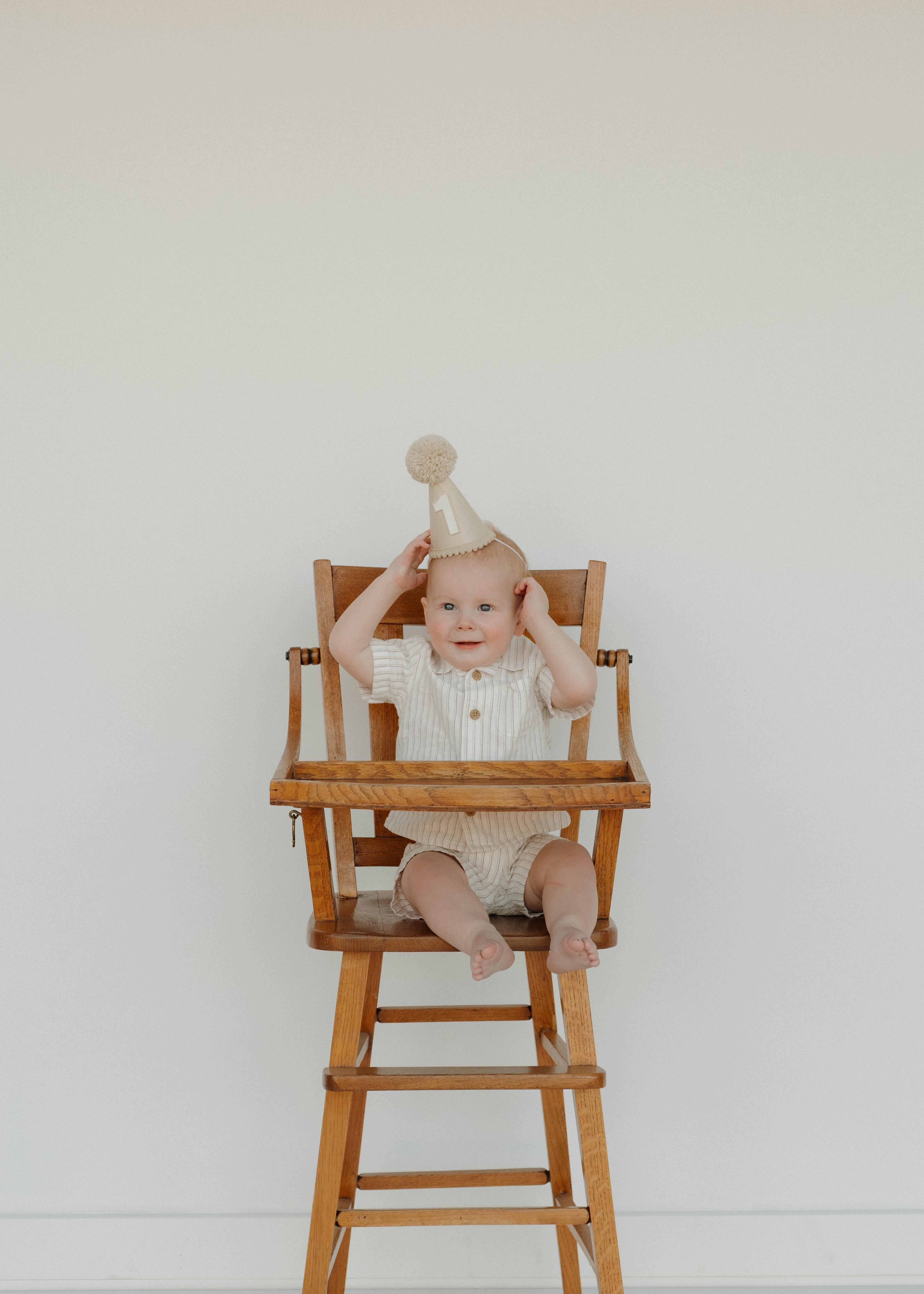 Portrait of Ashley, florist and photographer, smiling amongst her floral creations.