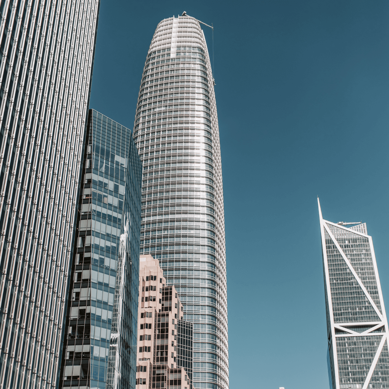 two people looking at a tablet and smiling