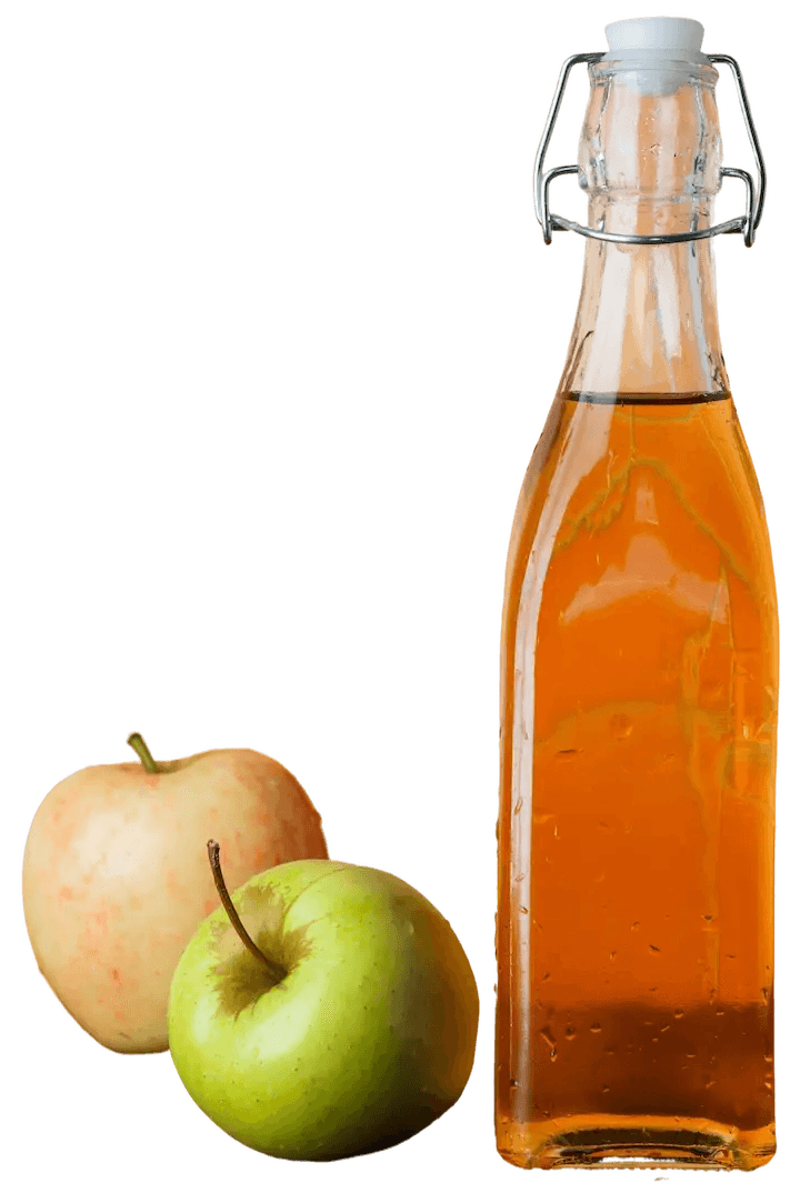 EIne Flasche firsch gepresszer Apfelsaft und daneben sind 2 Äpfel