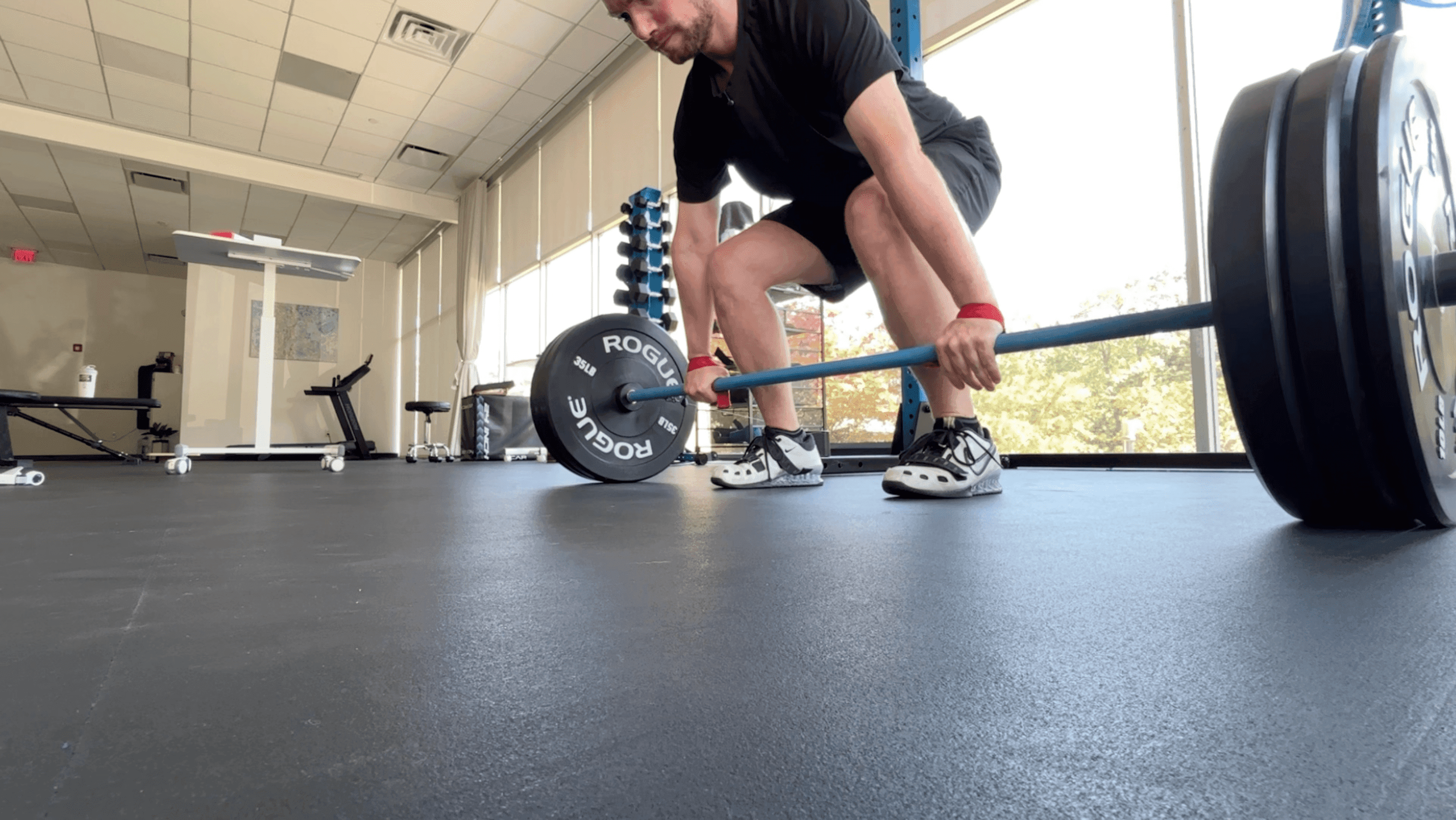 man performing a deadlift