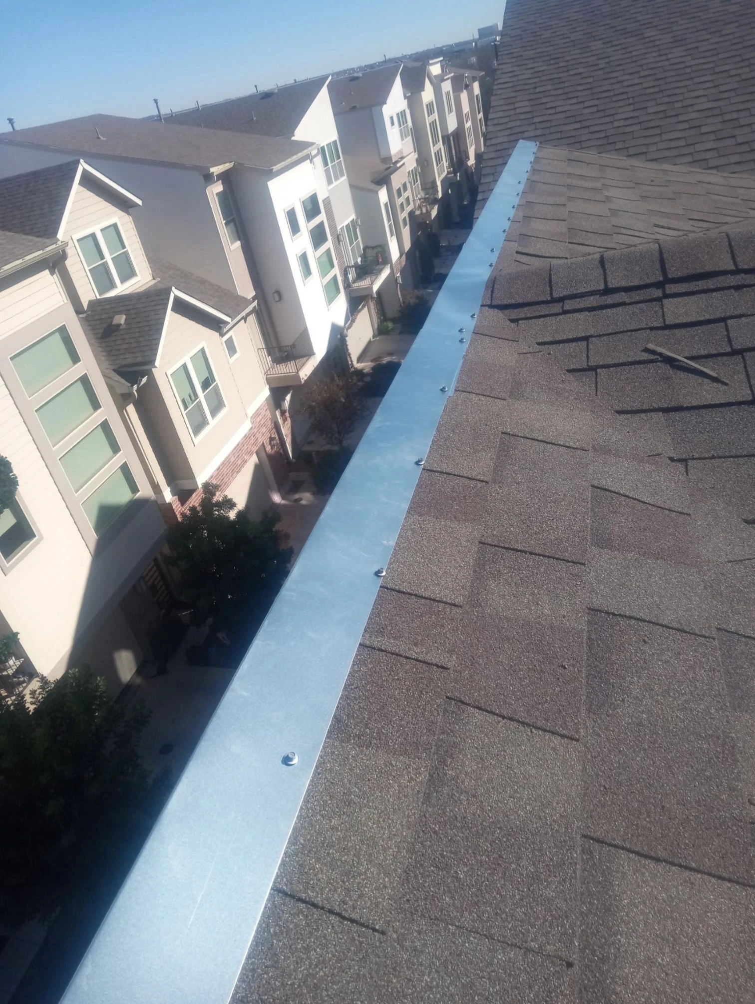 Finished repair: metal cap flashing at vulnerable roof edges in San Antonio, Texas.