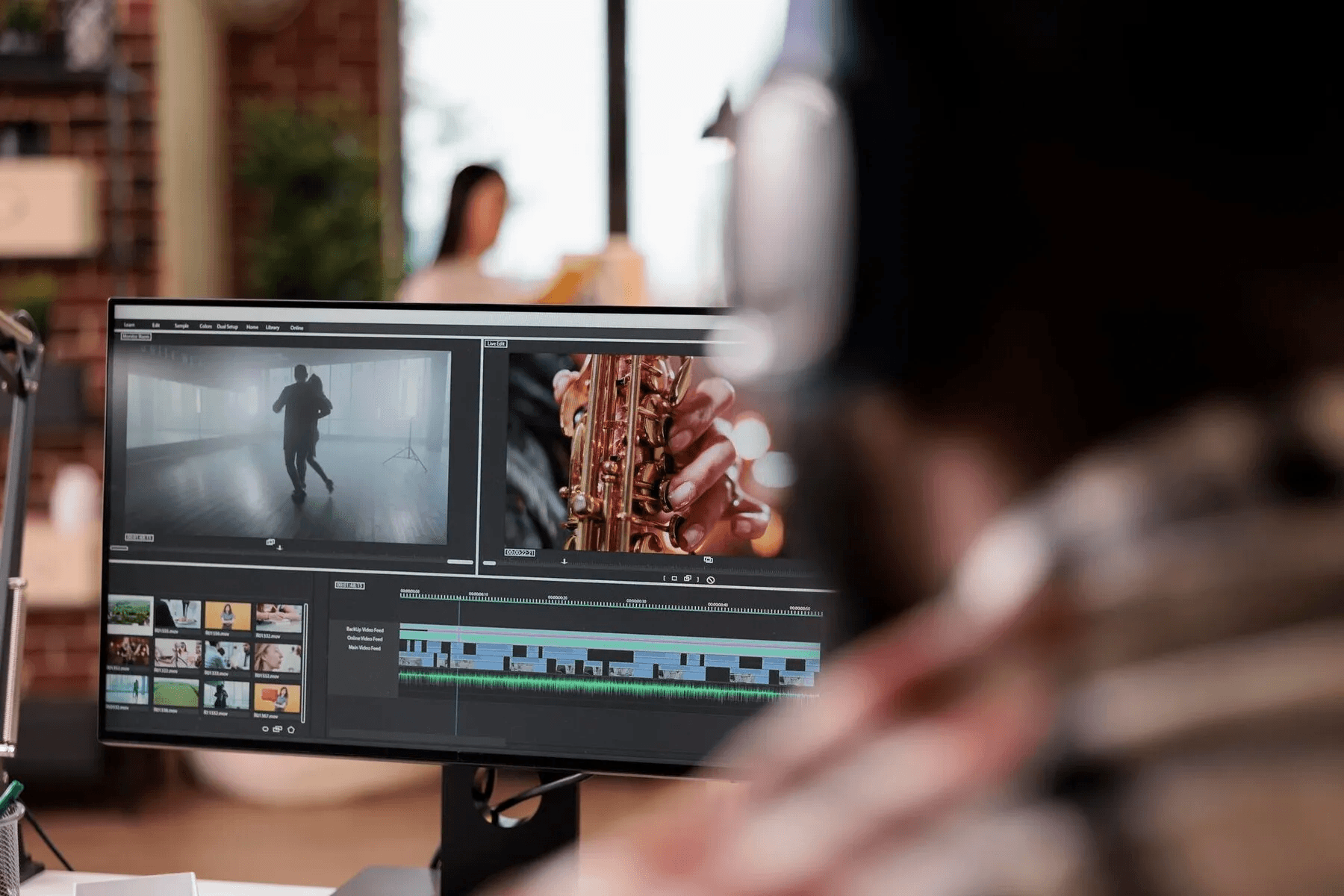Person edits video on computer screen -  Video Storytelling