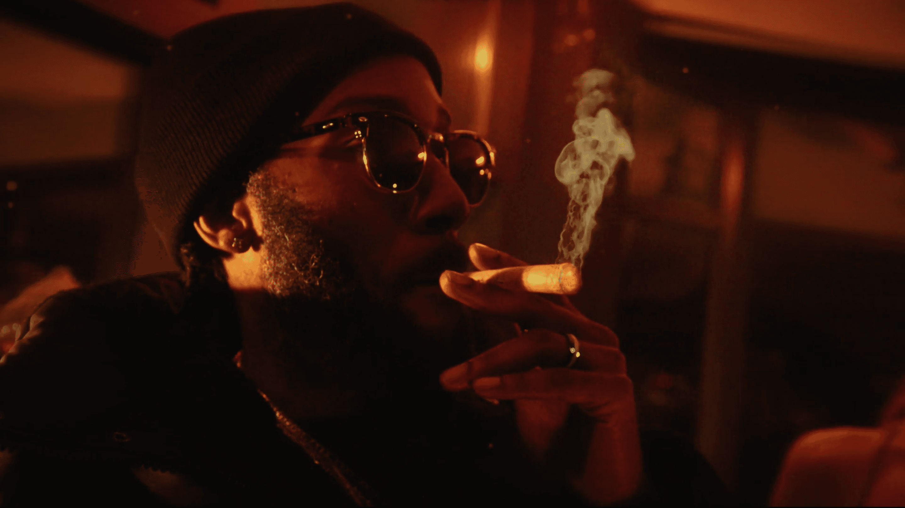 A man smoking at a bar in London 