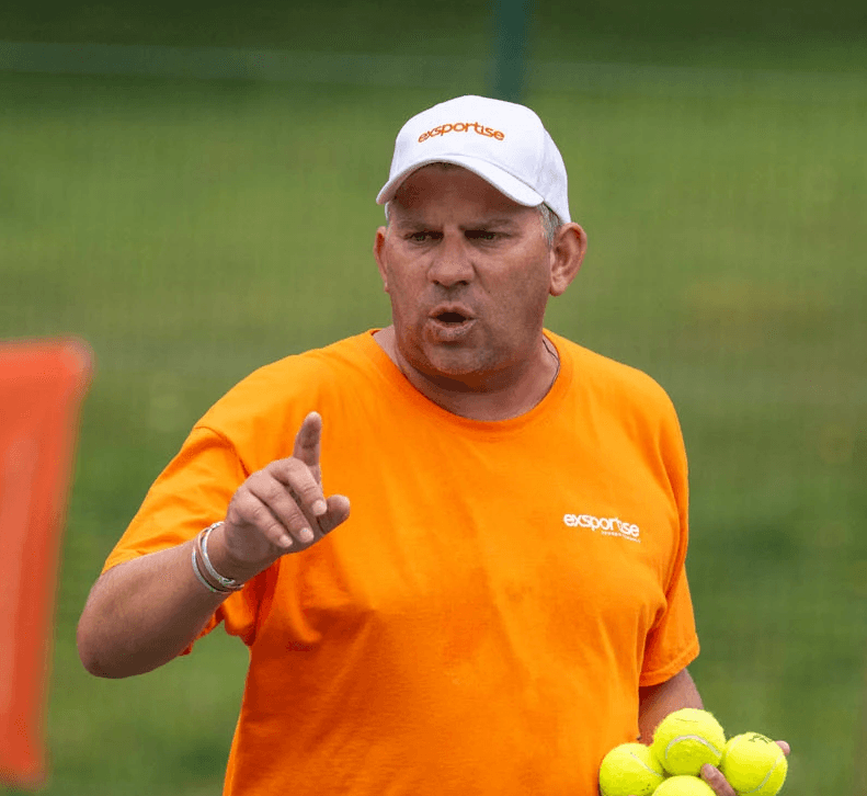 Alex Harvey coaching tennis.