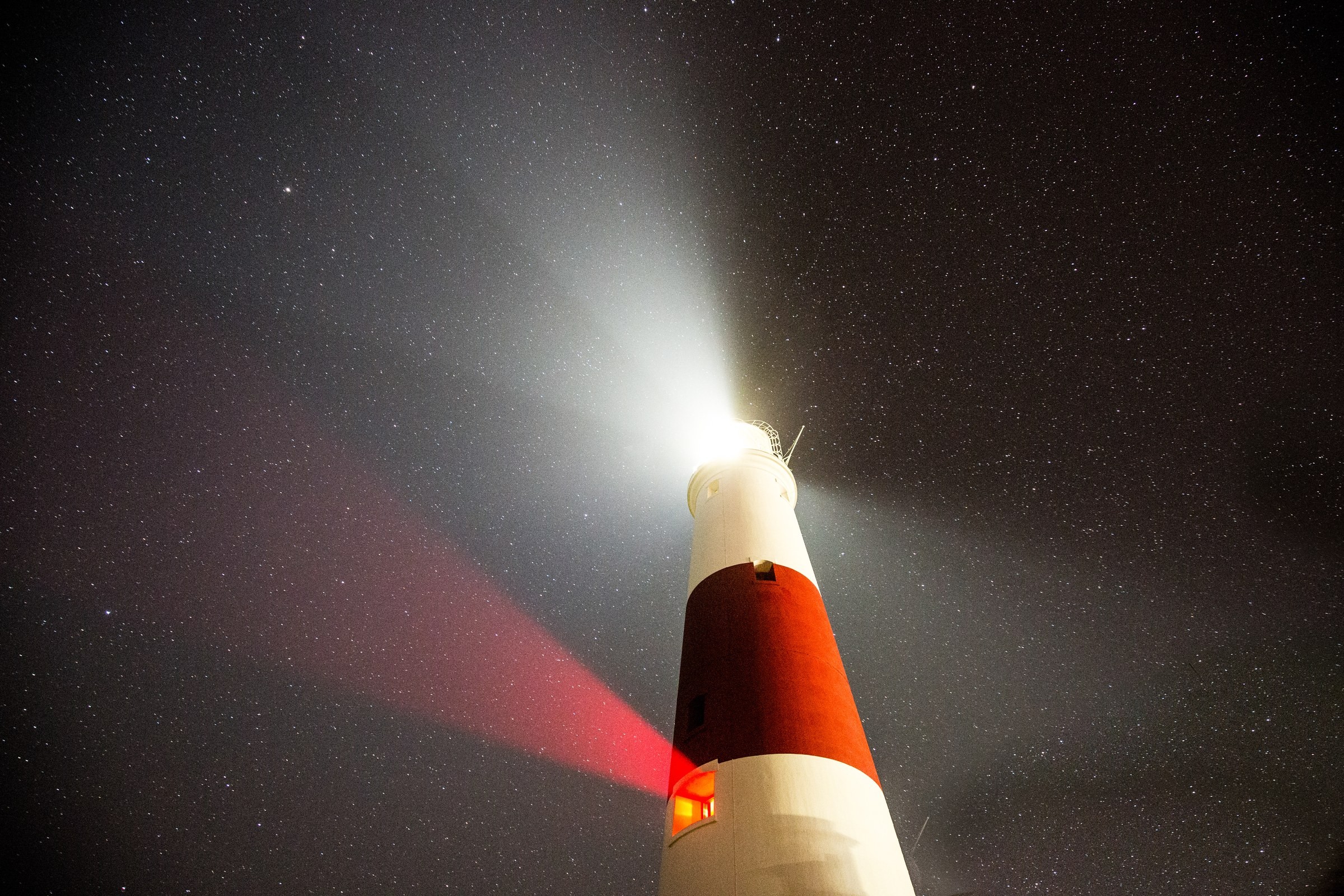 LANDSCAPE · Portland Lighthouse lighting the night sky.
