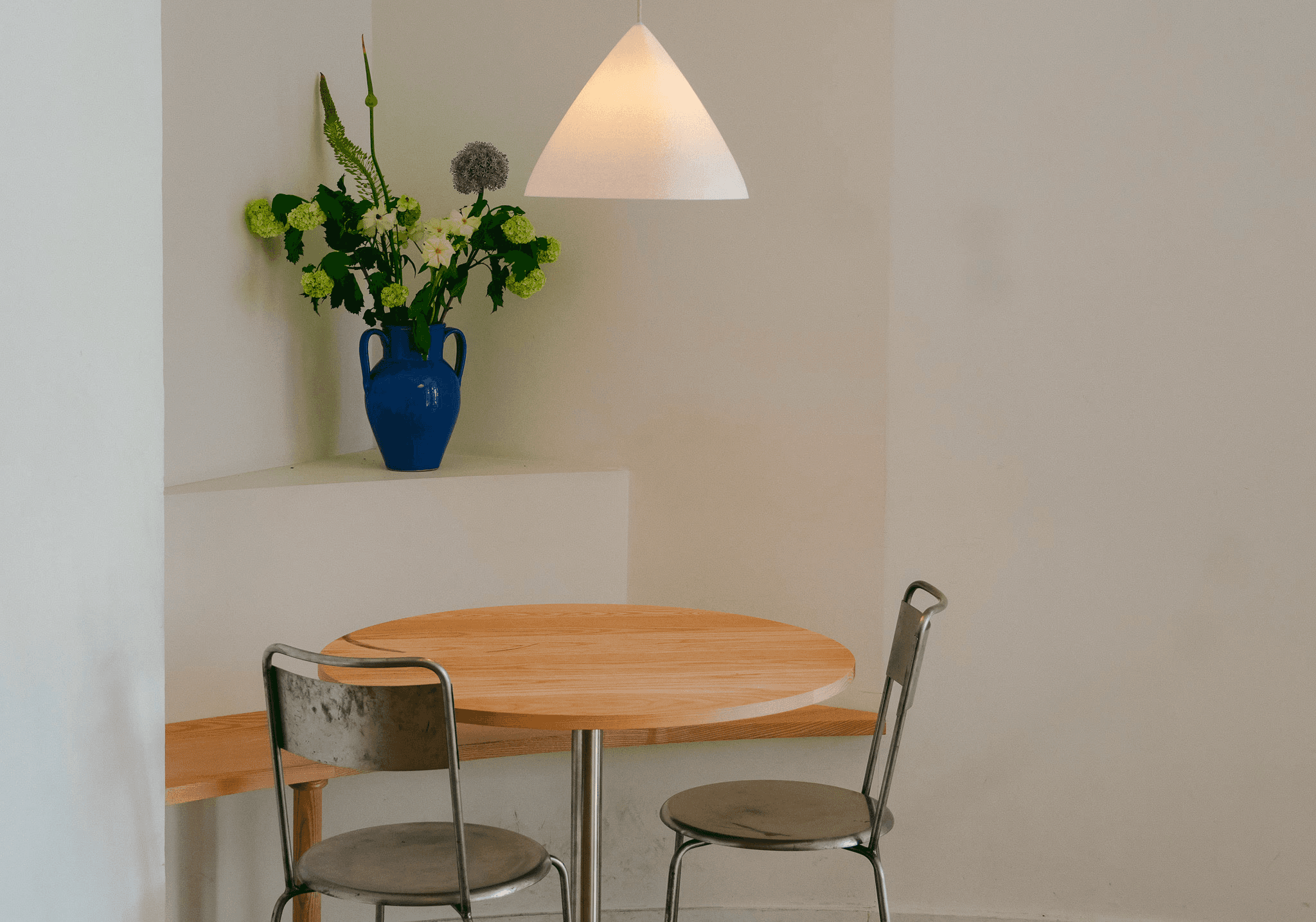 Silhouette of a person's face behind a wet surface.