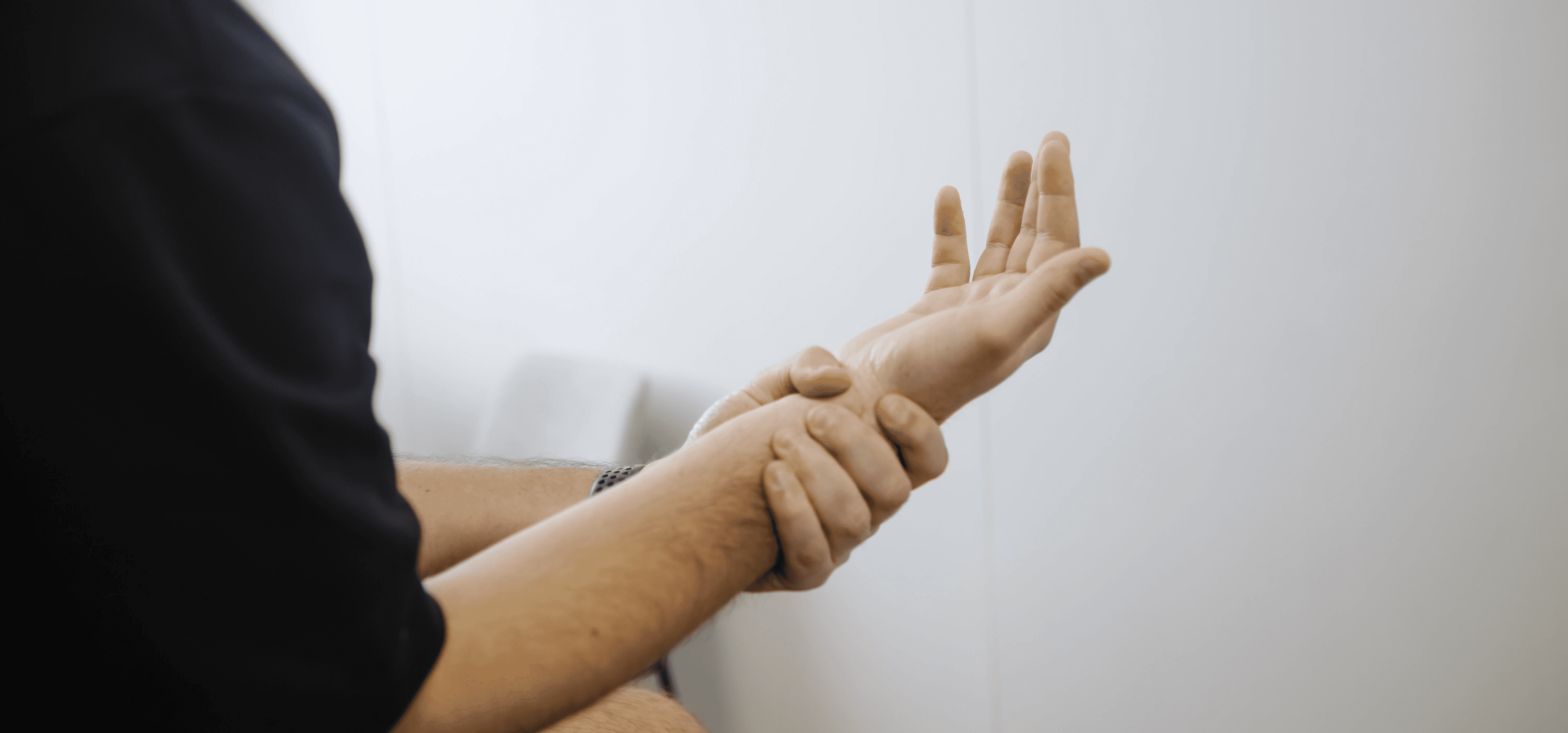 Patient holding their wrist due to RSI