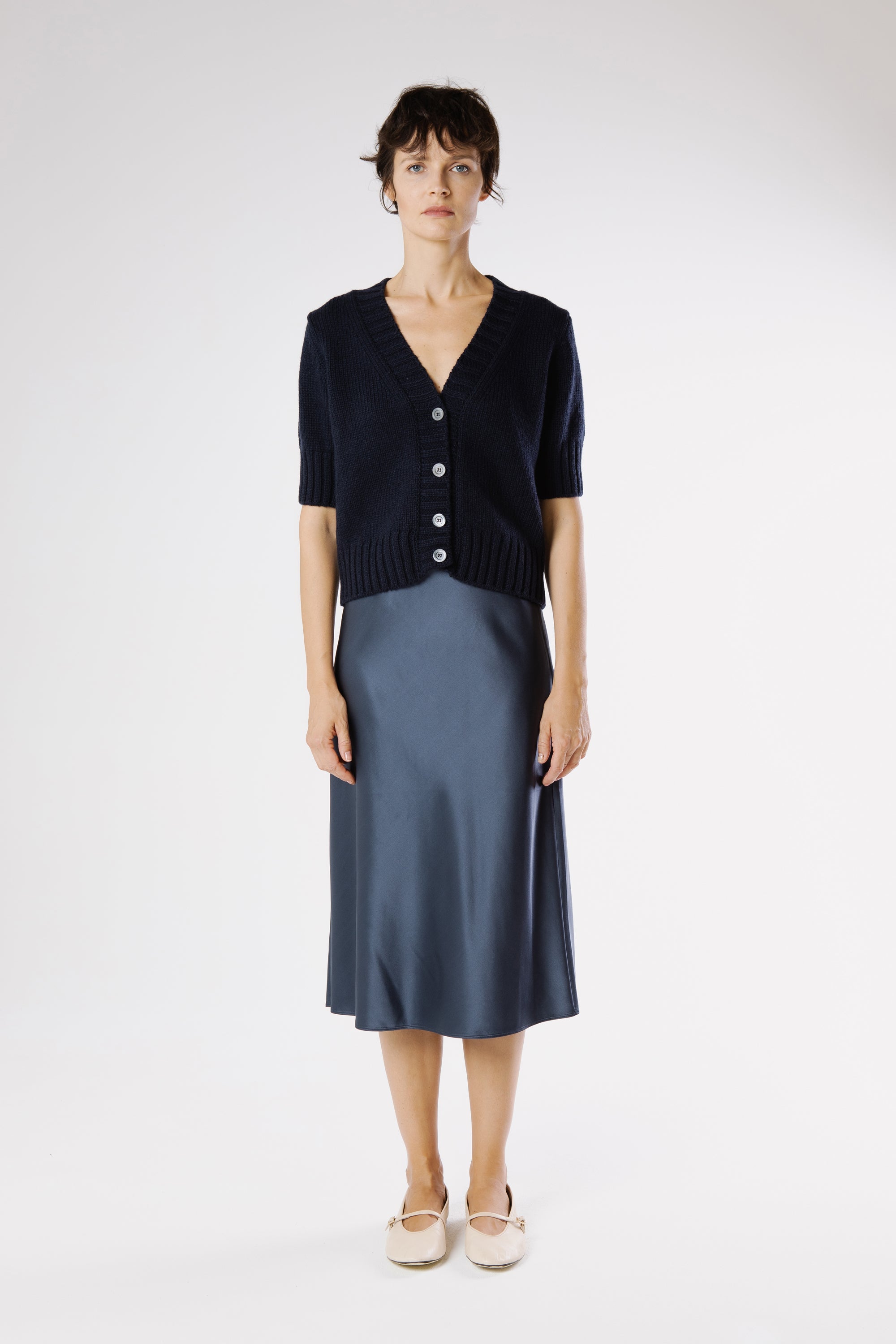 Front view of Artemisa Cashmere Cardigan Beluga in deep navy Italian cashmere with V-neckline and tonal buttons.