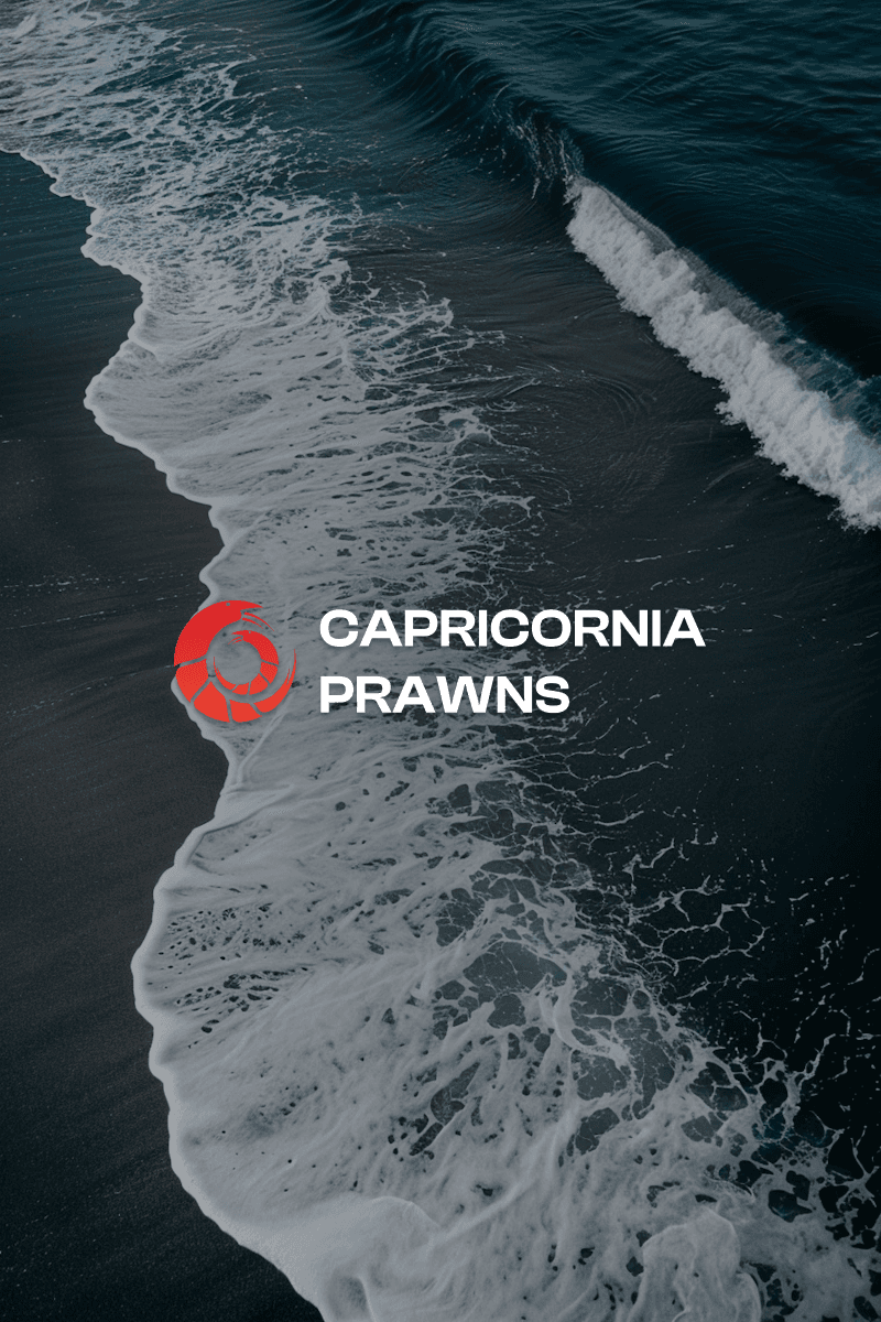 A man in a white lab coat working at a computer, viewing a 3D model on the screen in a laboratory or office setting.