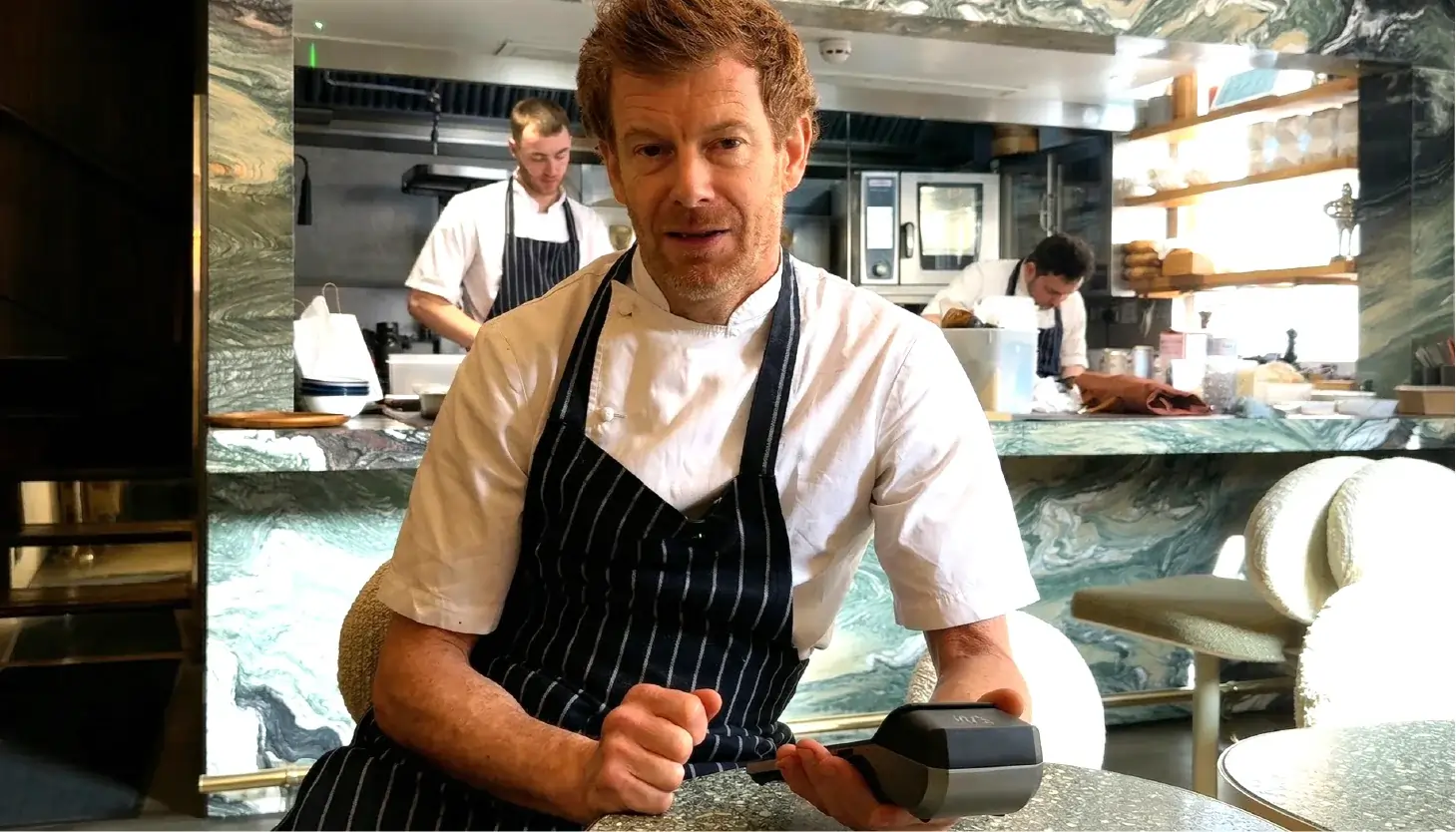 Tom Aikens holding a Labl.it device in Muse