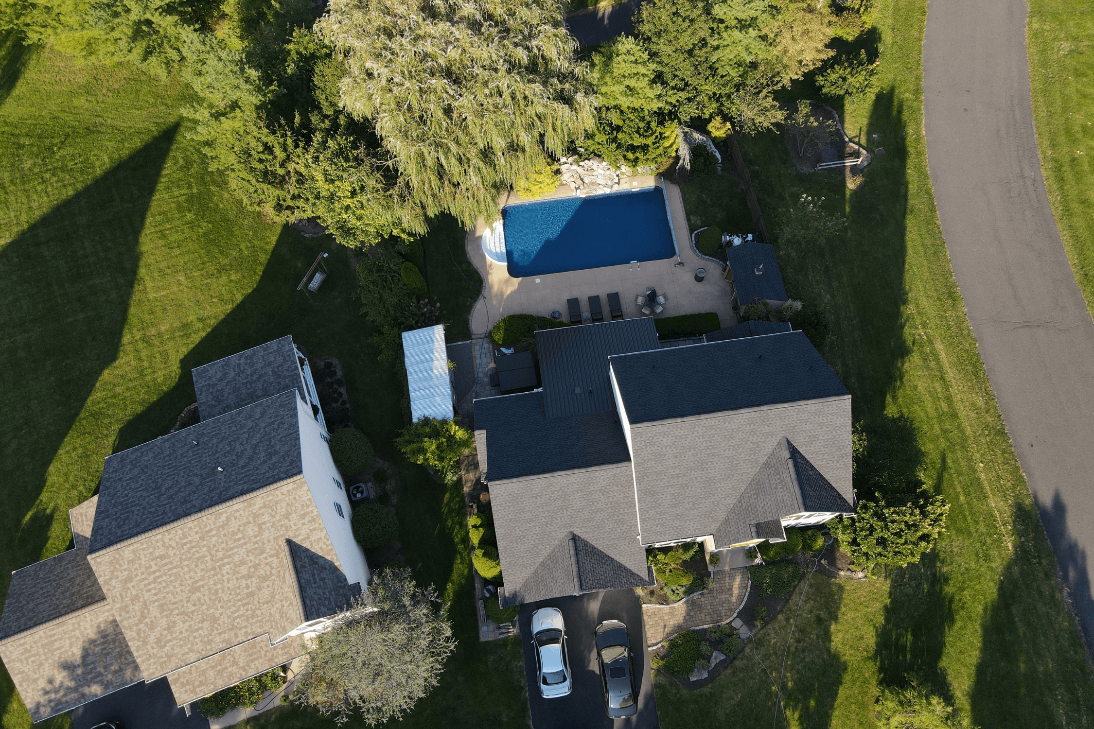 New GAF Timberline Charcoal architectural shingle roof installed on 25 sq home with metal sunroom roof in Shawnee, KS