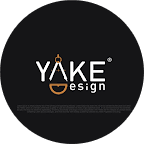 Editorial portrait of a young man with wavy hair in a knit sweater, looking over his shoulder in soft light.