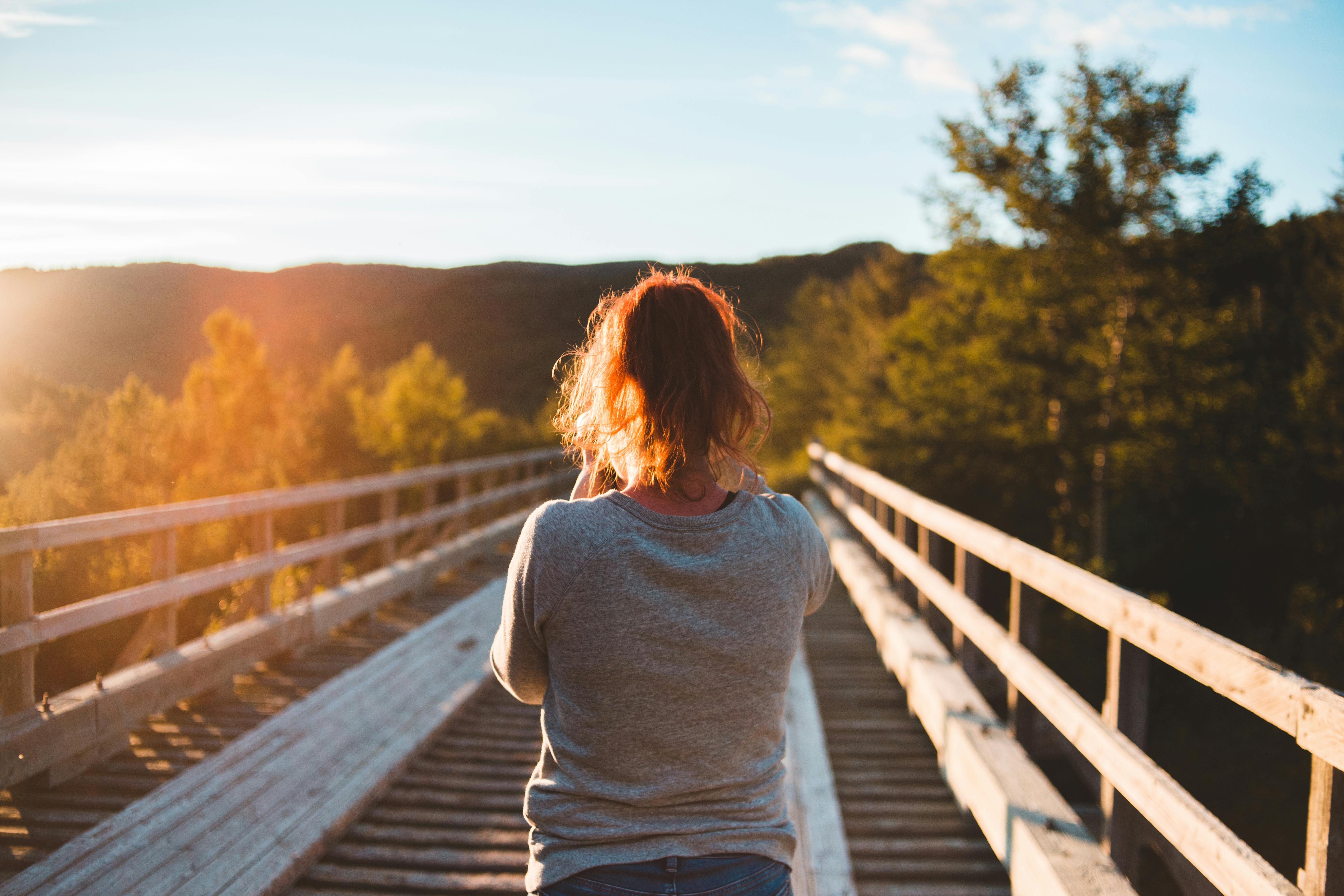 woman walking outdoors during hernia recovery, reconnecting with movement and aliveness