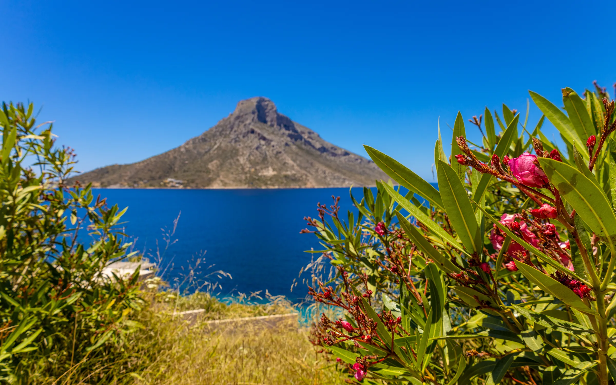 Telendos sett fra øya Kalimnos i Hellas | Expa Travel