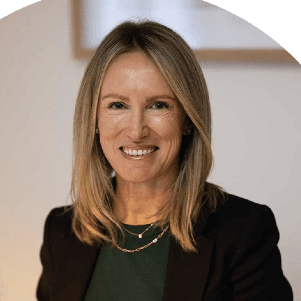 Smiling woman with straight blonde hair.