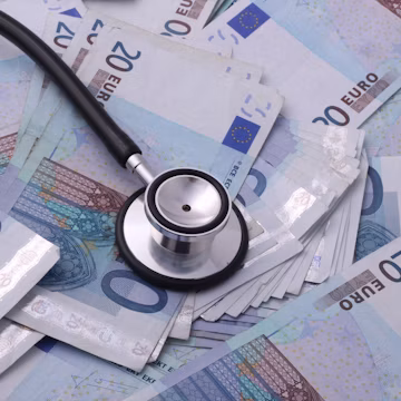silver and black stethoscope on 100 indian rupee bill