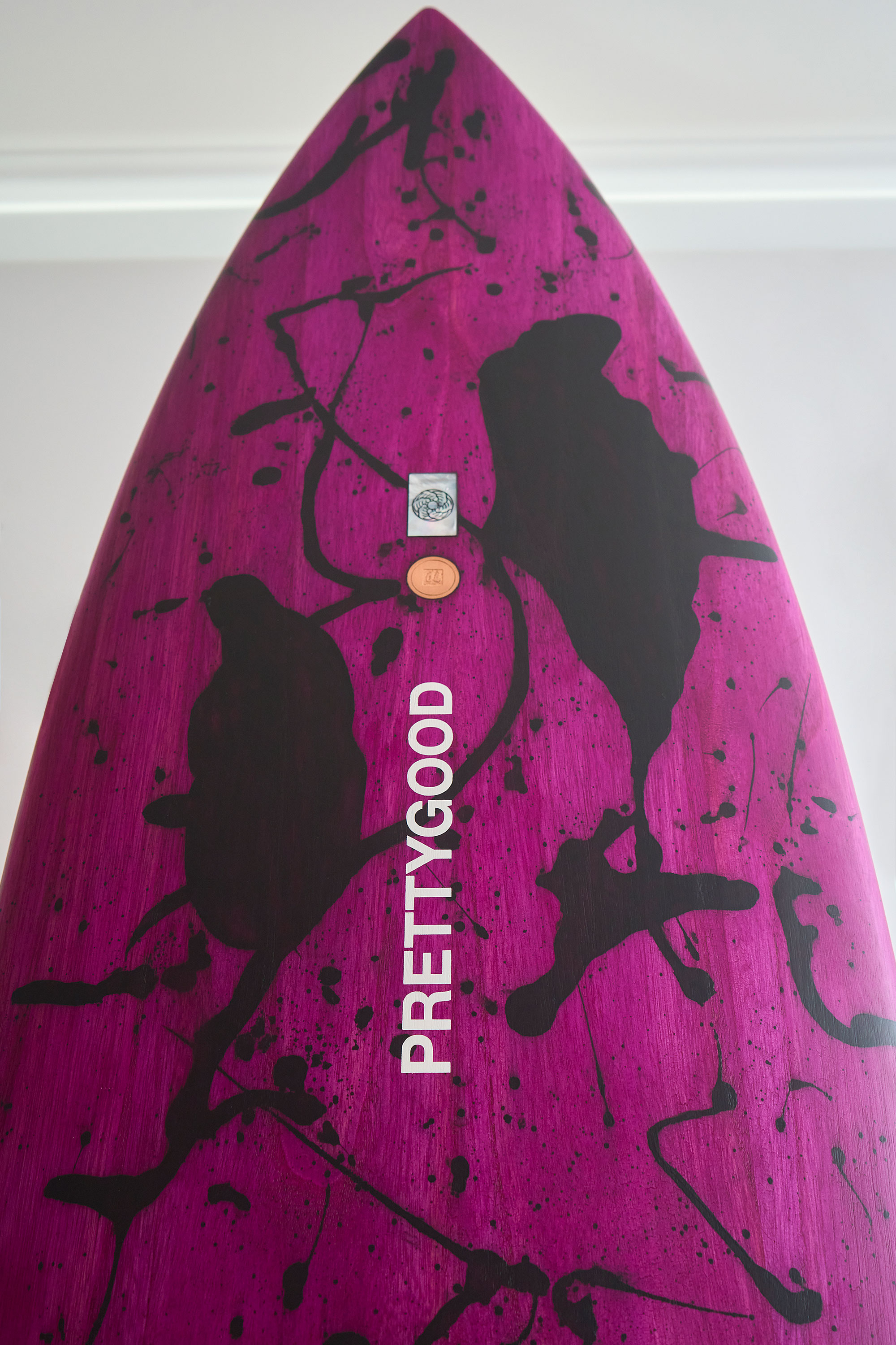 Wooden surfboard with mother of pearl and copper artwork