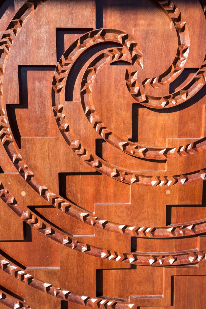 four person holding each others waist at daytime