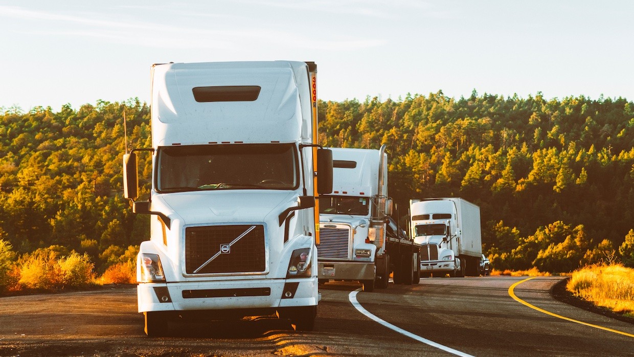 trucks on side of highway