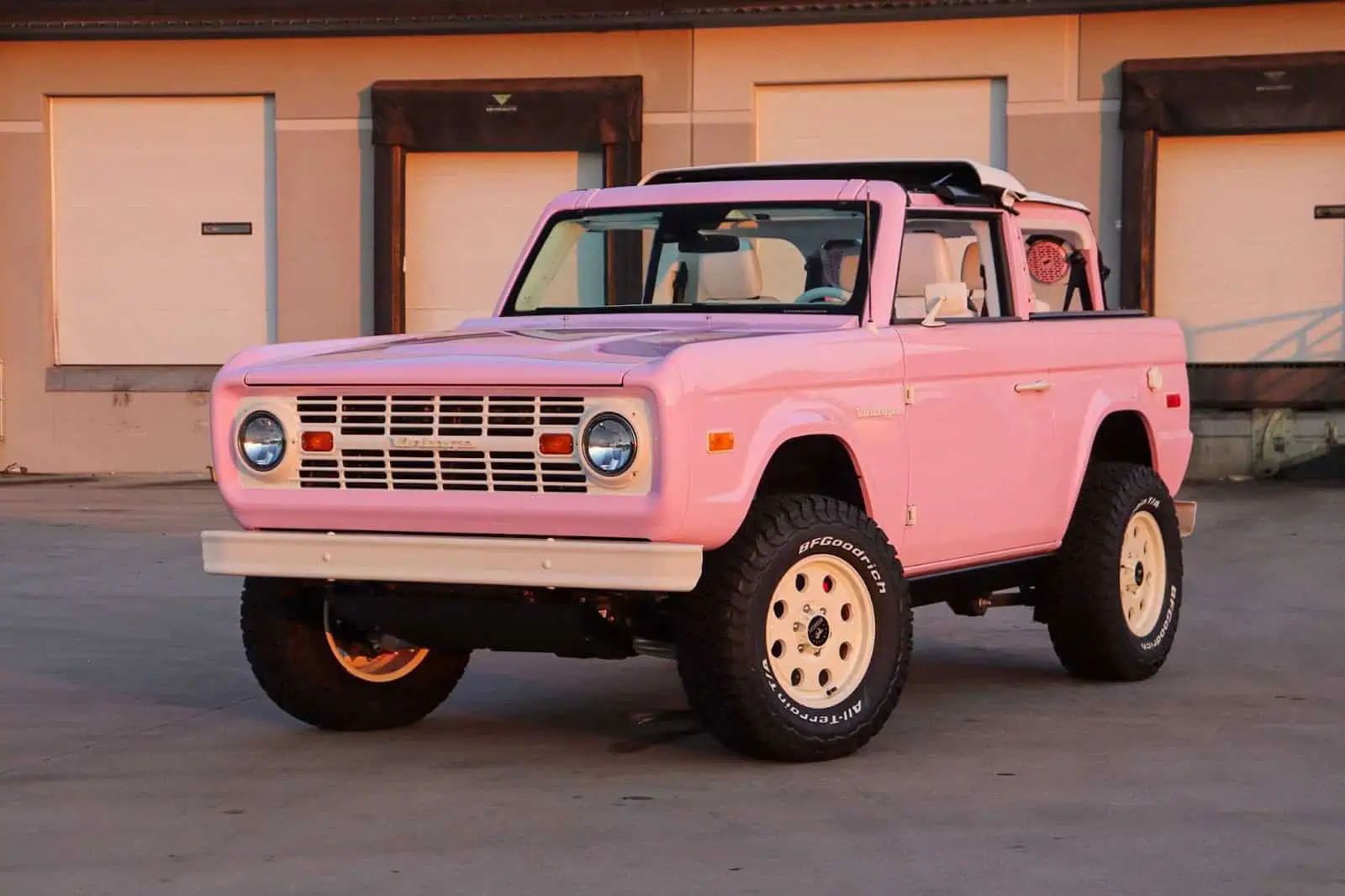 Man with camera near lake and mountains
