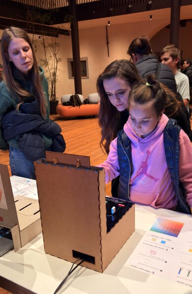 A child explores the Mix A Pixel prototype with an adult.