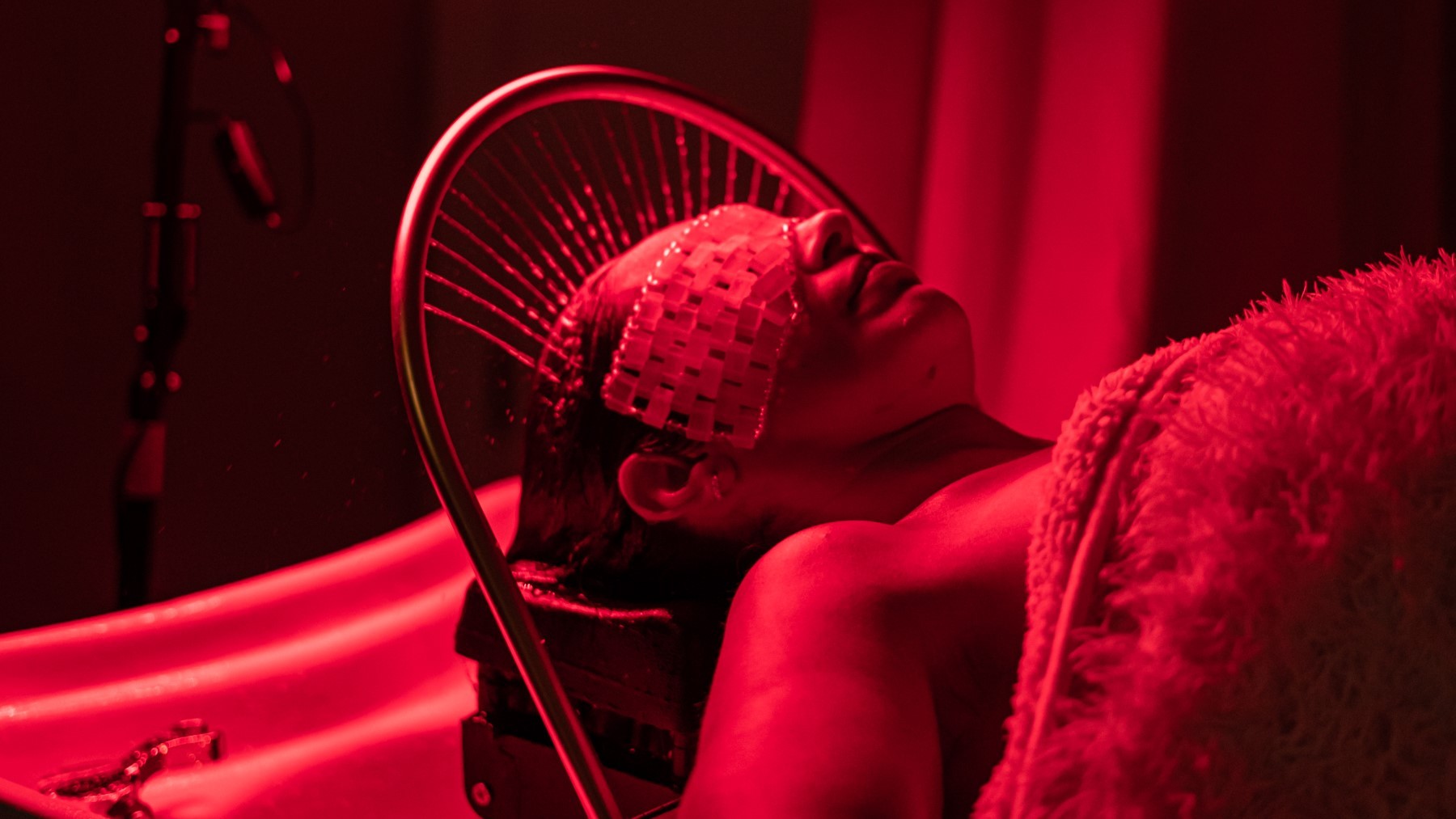 Woman receiving a scalp facial treatment 