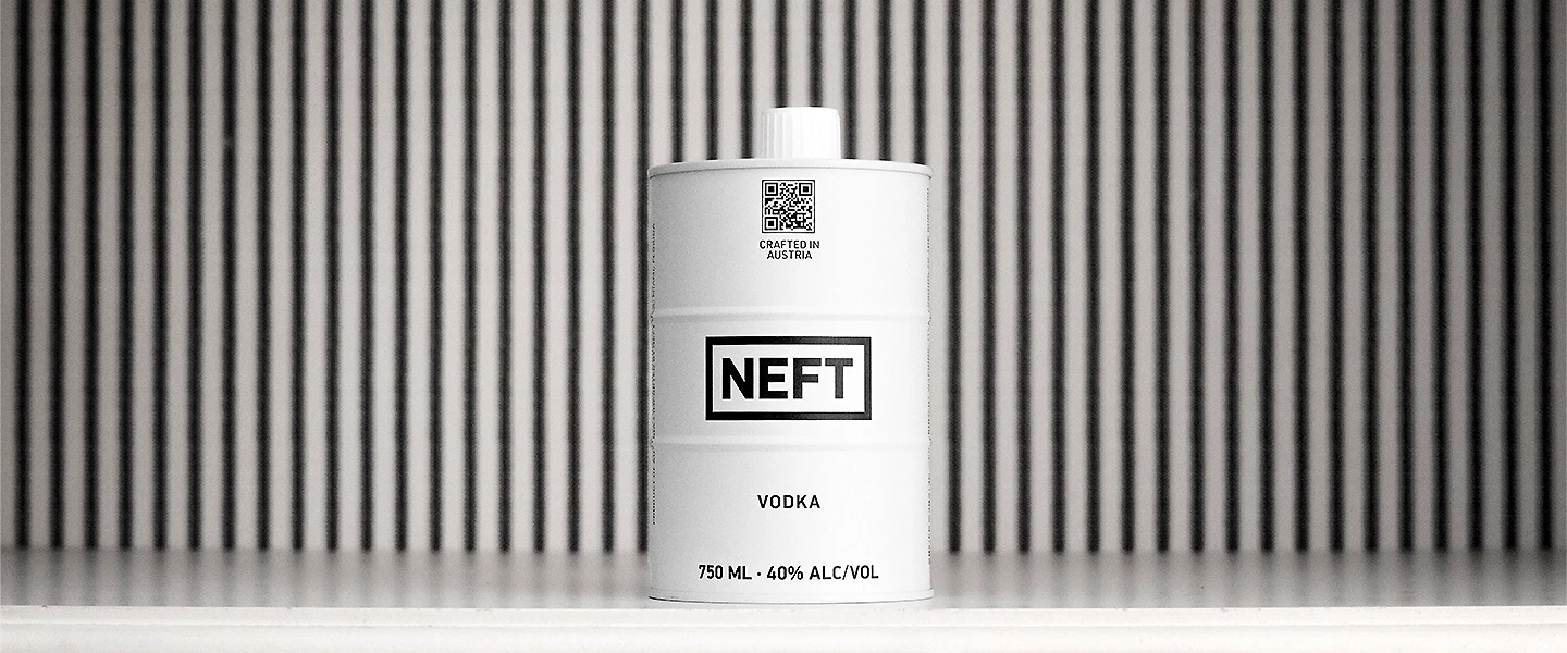 NEFT Vodka barrel on a white shelf with a slatted wall in the background.