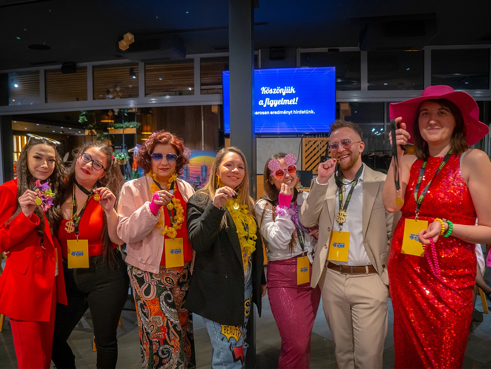 drawing a team of superheroes on a large sheet of paper at a team-building event