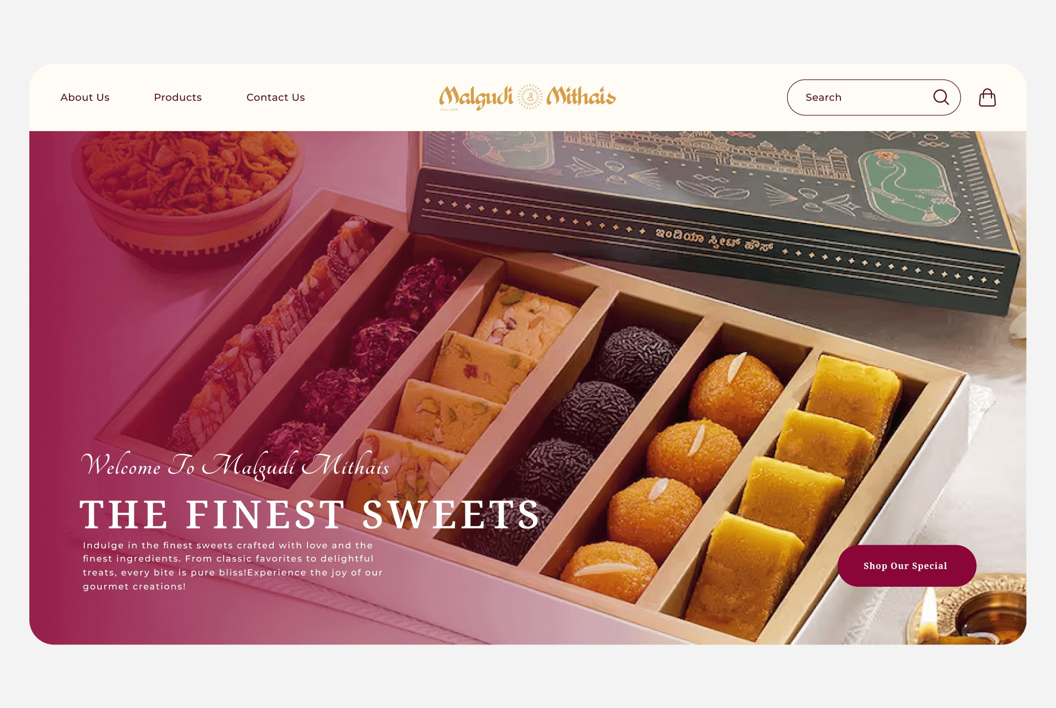 Malgudi Mithai homepage banner displaying premium Indian sweet box assortment with laddus, burfi, dry fruit sweets, and festive packaging.