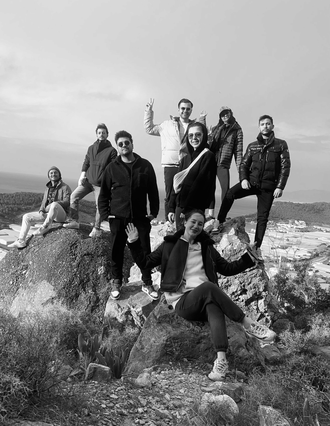Group of people relaxing outdoors on a field or lawn