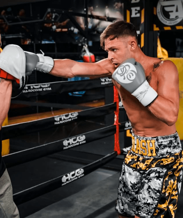 Danilo Dash Creati throwing a powerful punch on the heavy bag during training.